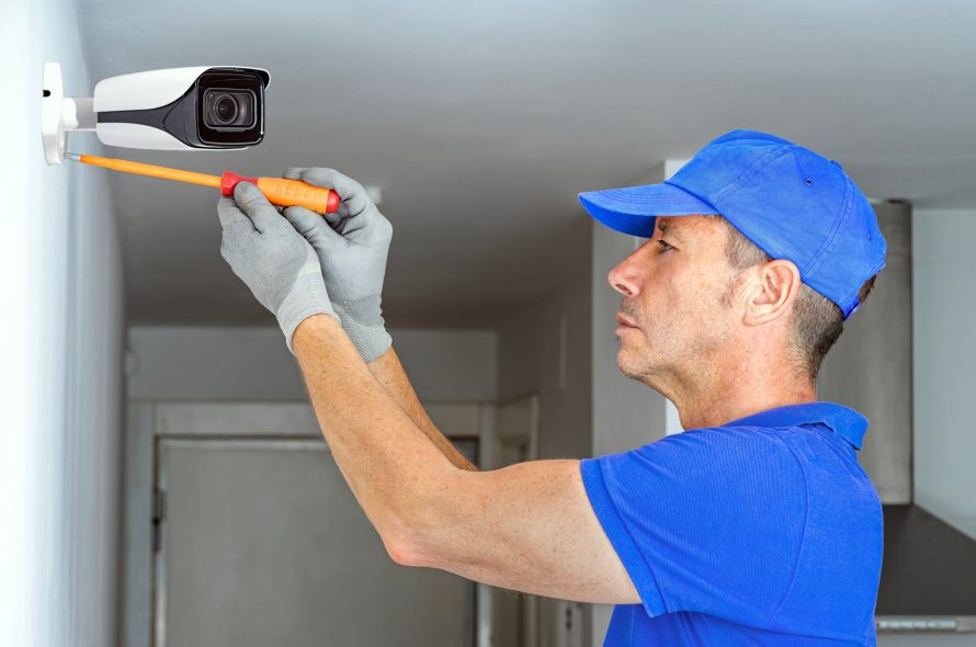 Technician,Installing,A,Home,Security,Cctv,Surveillance,Camera.